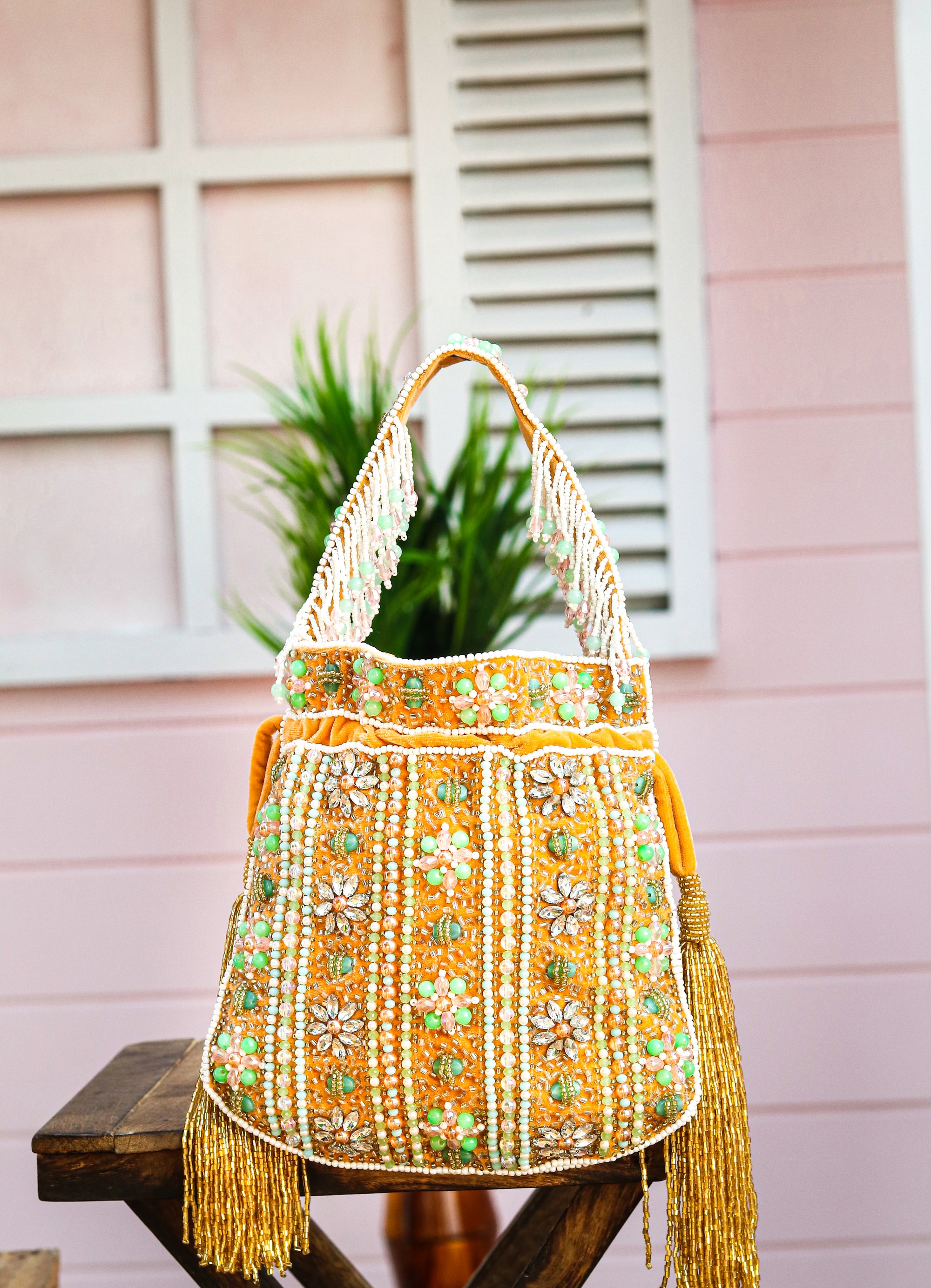 Women_Gold-Toned_Green_Embroidered_Tasselled_Potli_Clutch_nidhi_rathi