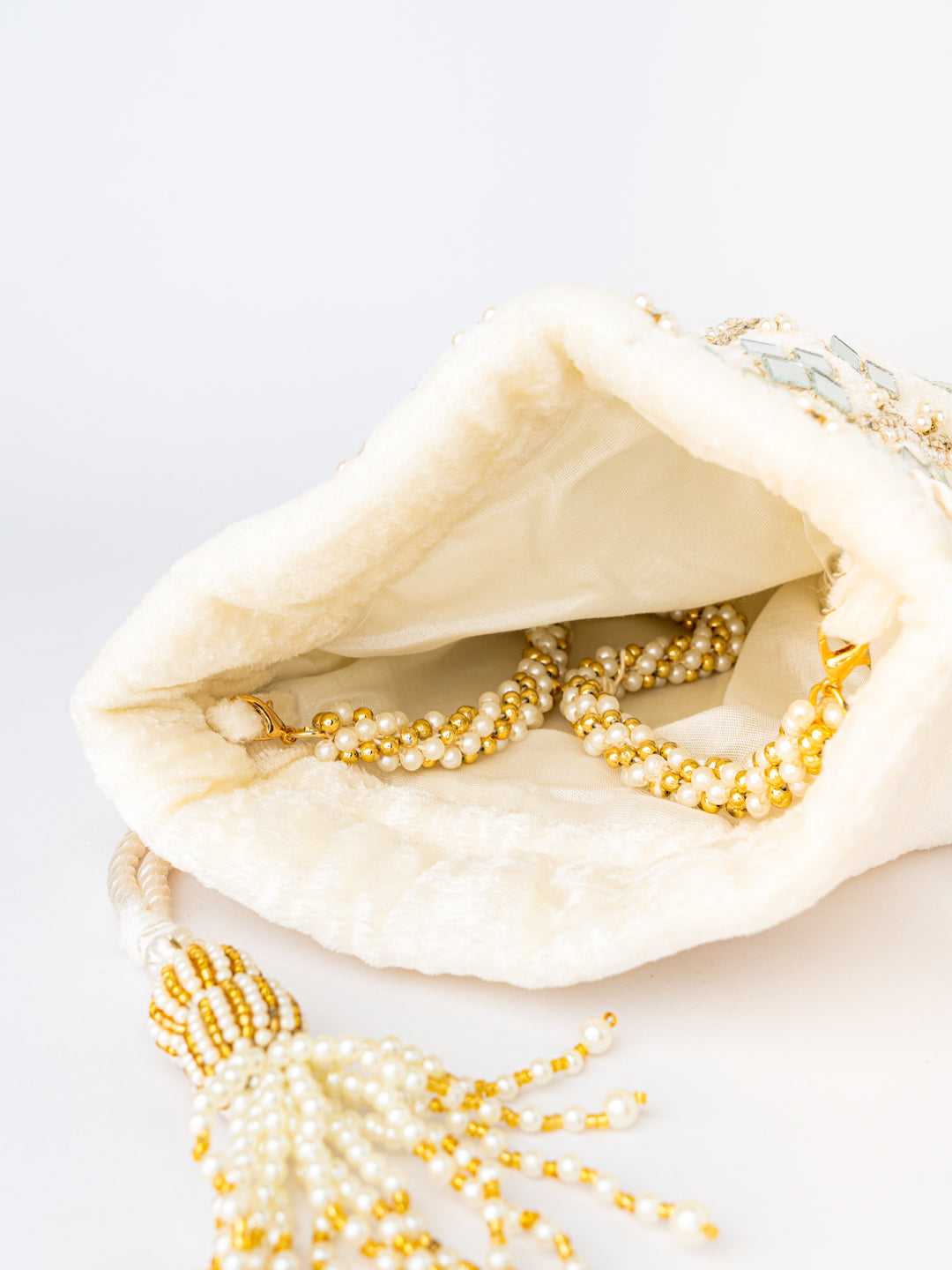 White_Mirror_Work_Embroidered_Potli_Clutch_nidhi_rathi