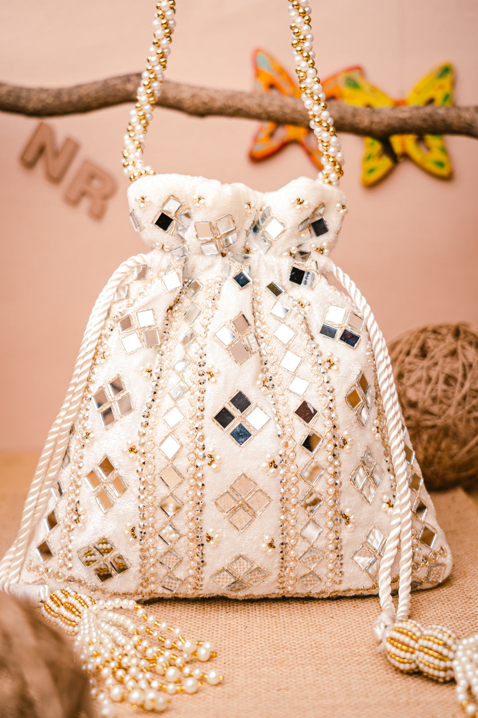 White_Mirror_Work_Embroidered_Potli_Clutch_nidhi_rathi