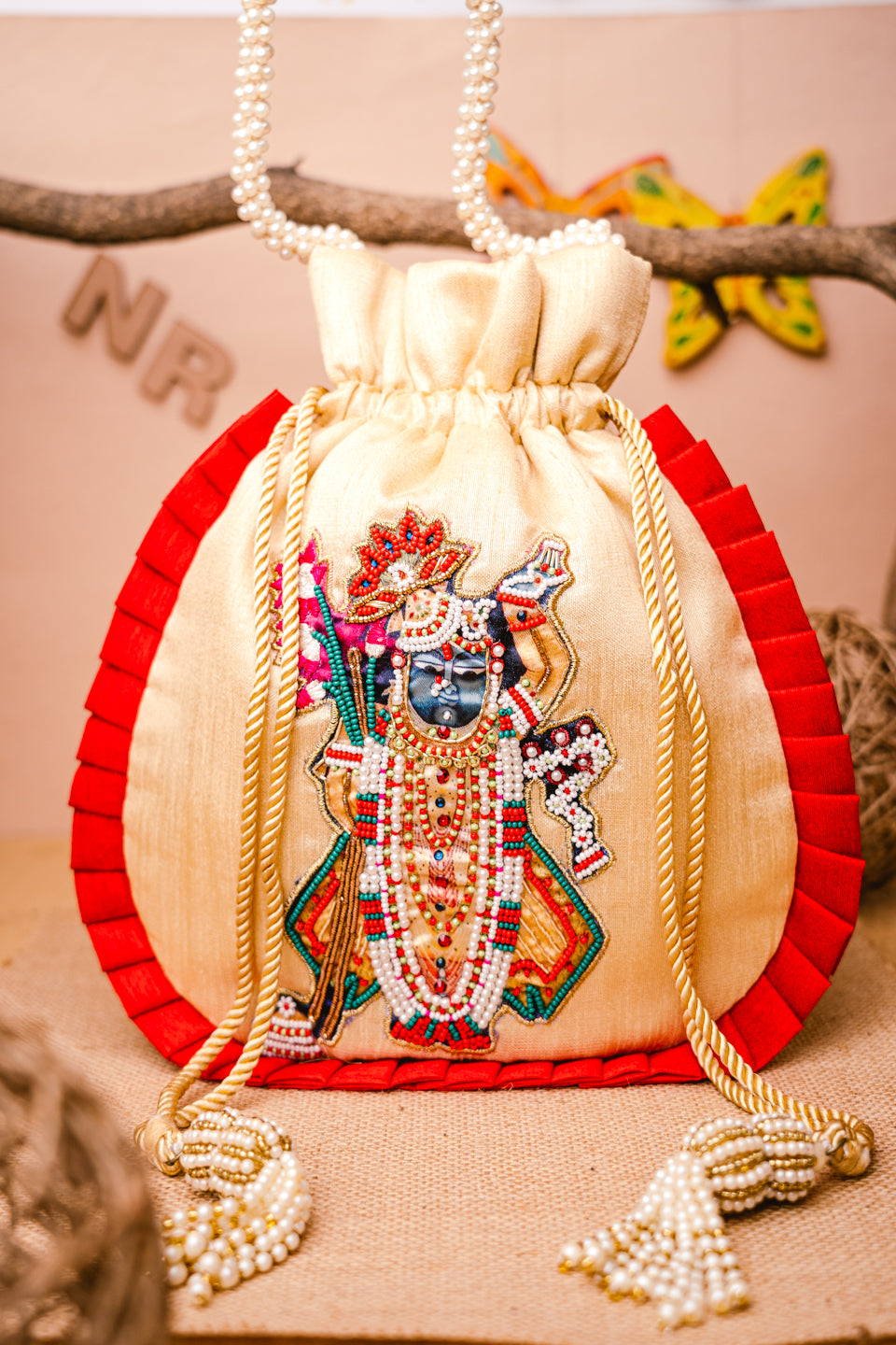 Cream-Coloured_Red_Embroidered_Potli_Clutch_nidhi_rathi