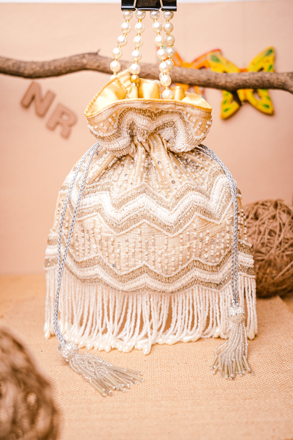 Cream-Coloured_Gold-Toned_Embellished_Potli_Clutch_nidhi_rathi
