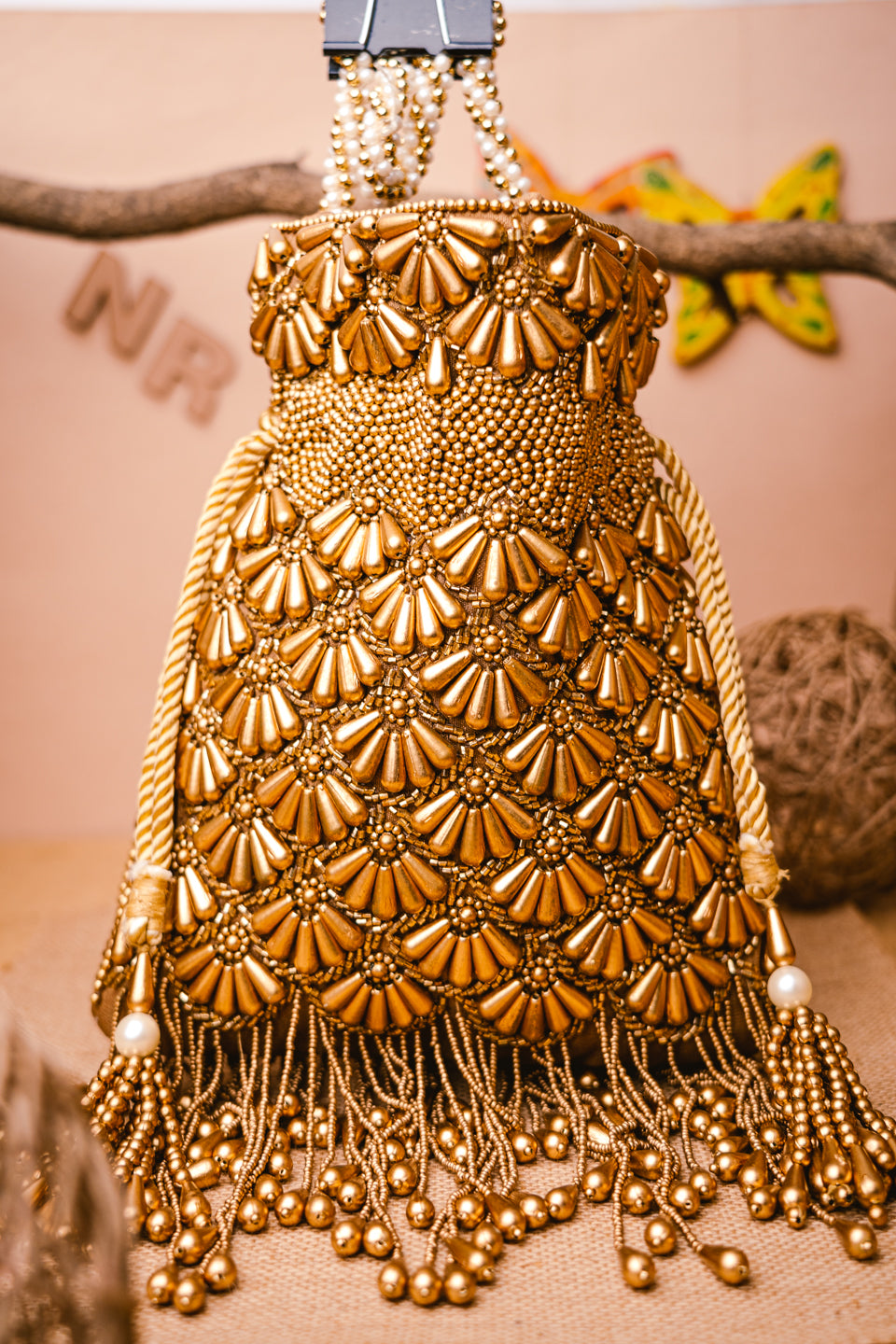 Cream-Coloured_&_Gold-Toned_Embroidered_Potli_Clutch_nidhi_rathi
